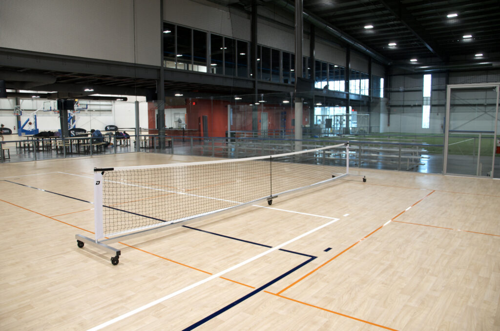 The pickleball net on the court at Sawmill Sports Hub,