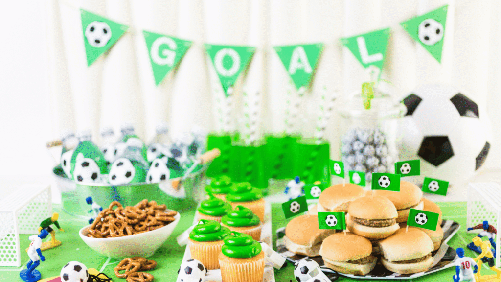 A tablescape of cupcakes and snacks for a kids soccer themed birthday party at Sawmill Sports Hub.