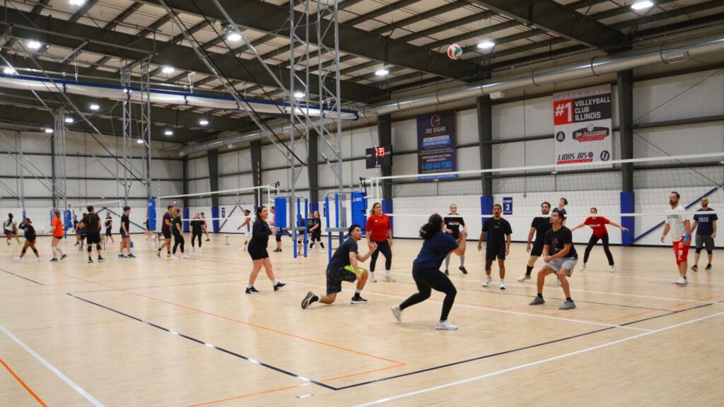 A group of adults playing recreational volleyball at Sawmill Sports Hub.