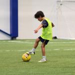 A young soccer player practices at Sawmill Sports Hub.