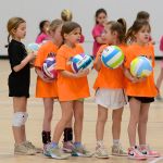 Youth rec volleyball players wearing their jerseys at Sawmill Sports Hub.